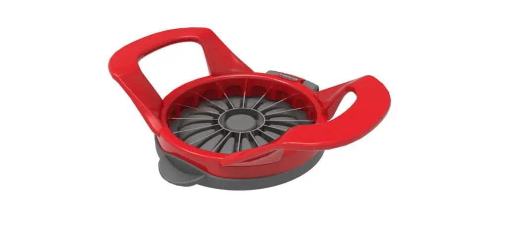 A red and gray apple slicer with two large handles and multiple metal blades arranged in a circular pattern for cutting apples into even slices.