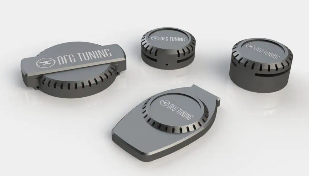 Four gray, round and rectangular electronic devices labeled “DFG TUNING” are arranged on a white surface. Each device features vent-like slits and a logo with a circular icon.
