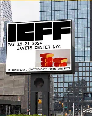 A digital billboard advertises the ICFF International Contemporary Furniture Fair, happening May 19-21, 2024, at Javits Center NYC, with a modern furniture image and city buildings in the background.